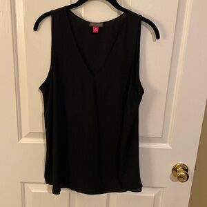 Vince Camuto black sheer sleeveless blouse. Can wear with a suit or separate. M